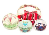 A Group of Four Glass Paperweights Diameter of largest 8 inches — SECOND HALF 20TH CENTURY