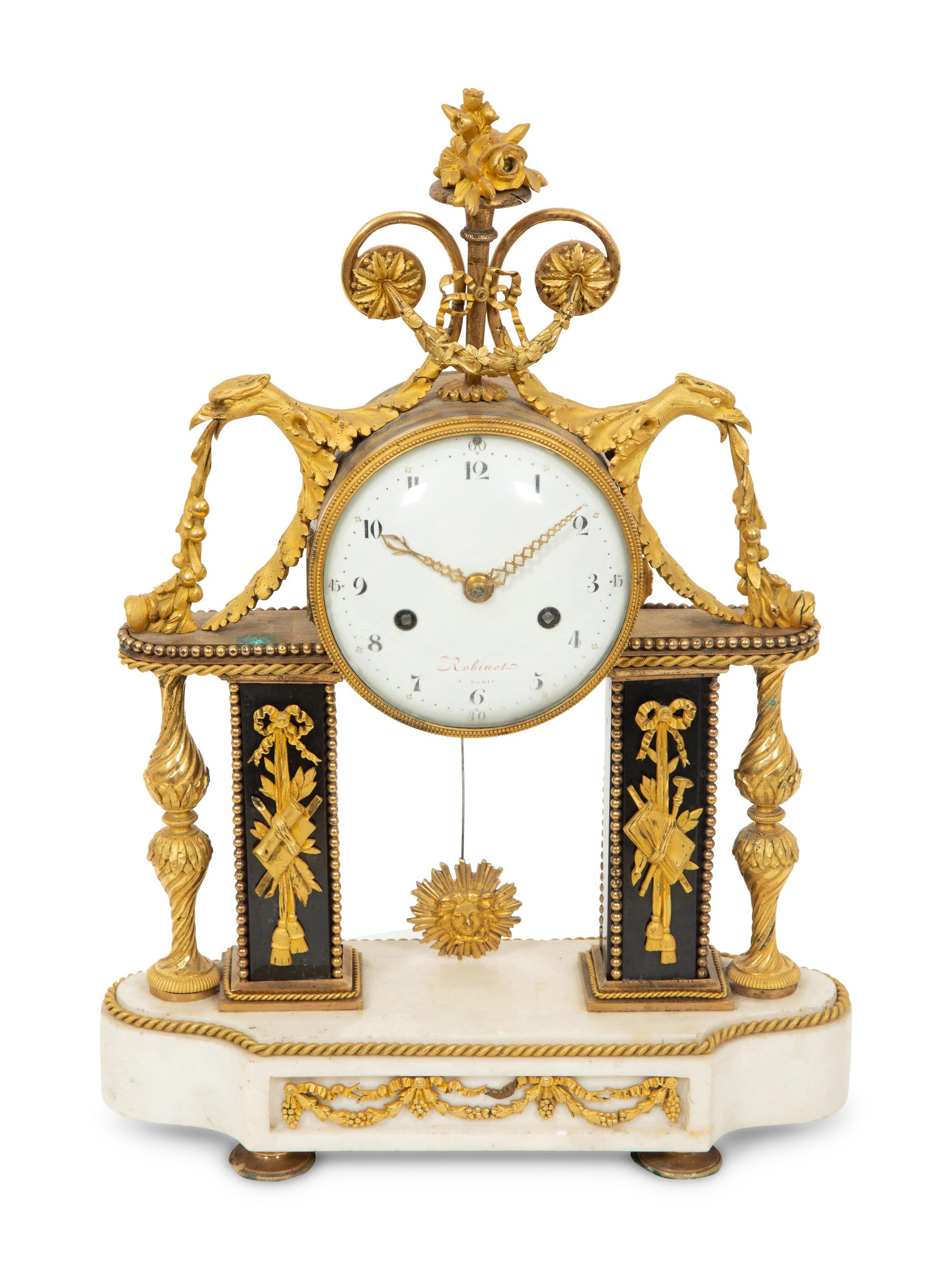A Louis XVI Gilt Bronze and Marble Mantel Clock