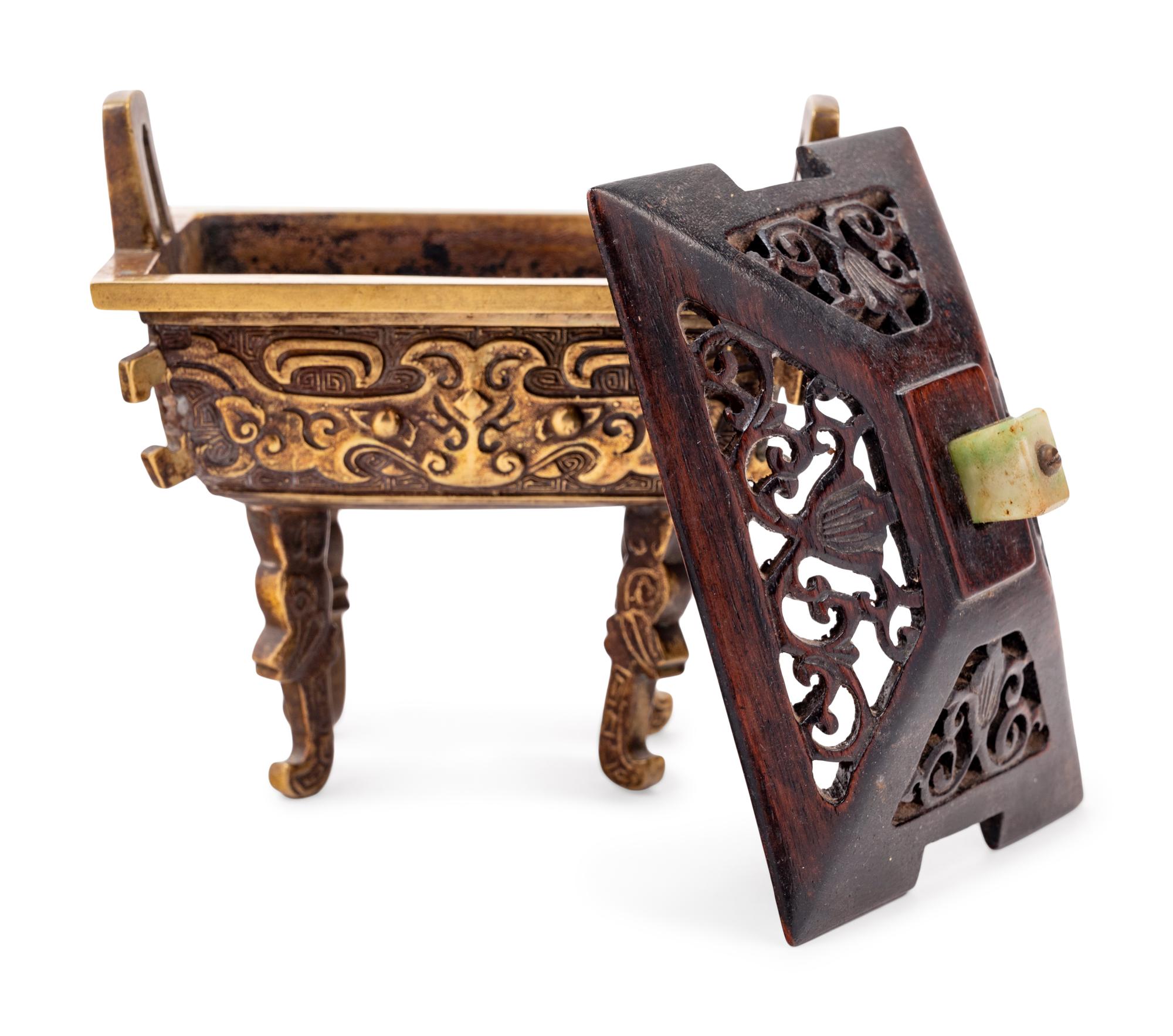 A Chinese Parcel-Gilt Bronze Ding- Form Incense Burner