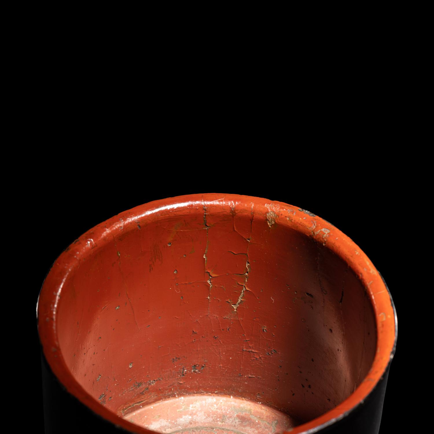 A Chinese Black and Red Lacquered Brushpot, Bitong, Wanli Mark 萬曆丙午（1606）款黑漆素面筆筒