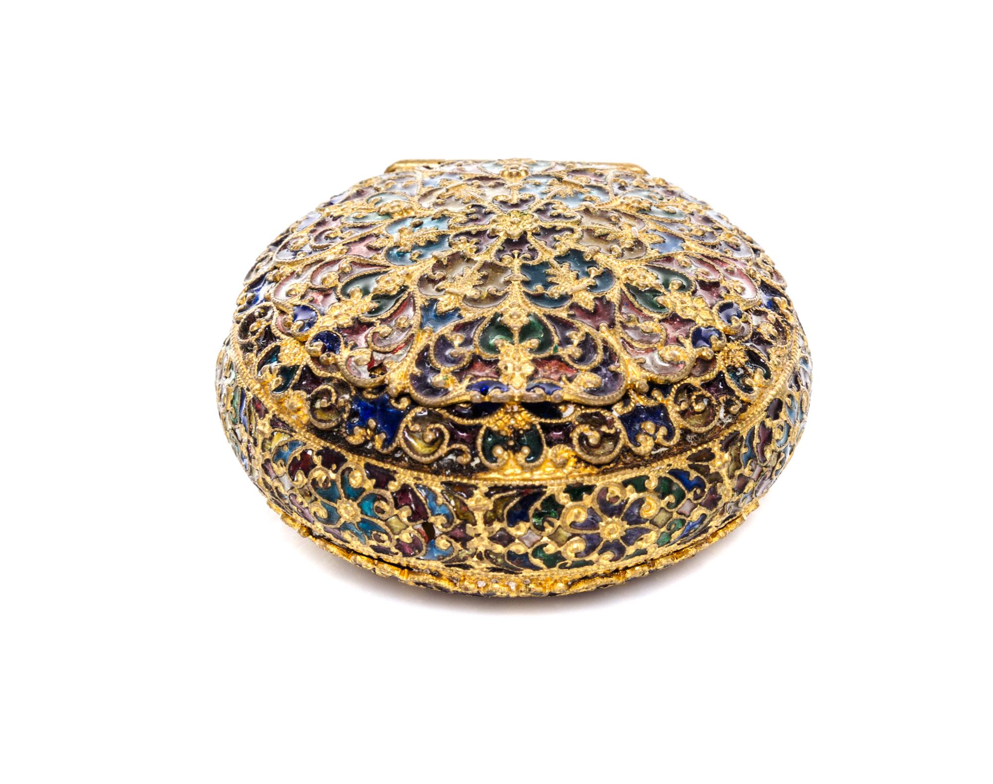 A Plique a Jour Box, 20th Century, of circular form, having a hinged lid with floral decoration.