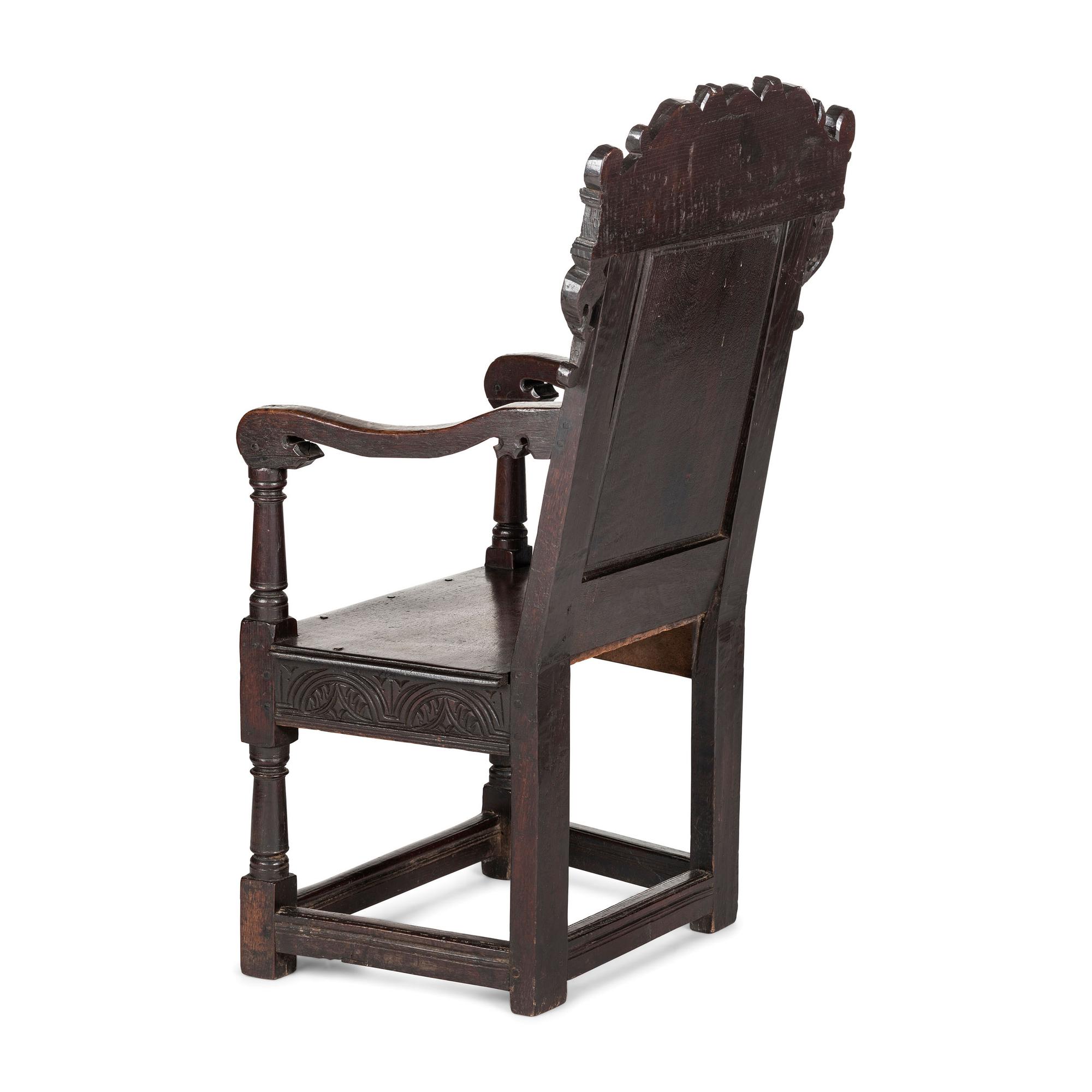 An English Carved Oak and Elm Panel-Back Armchair