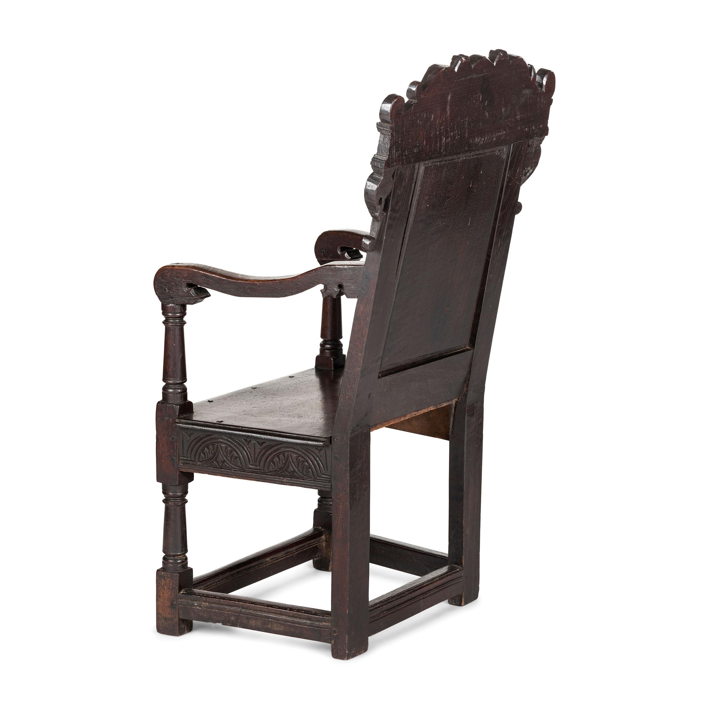 An English Carved Oak and Elm Panel-Back Armchair