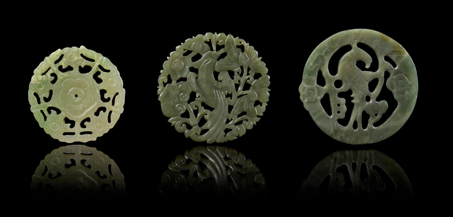 Three Pierce Carved Jade Circular Pendants Diameter of largest 2 1/2 inches.