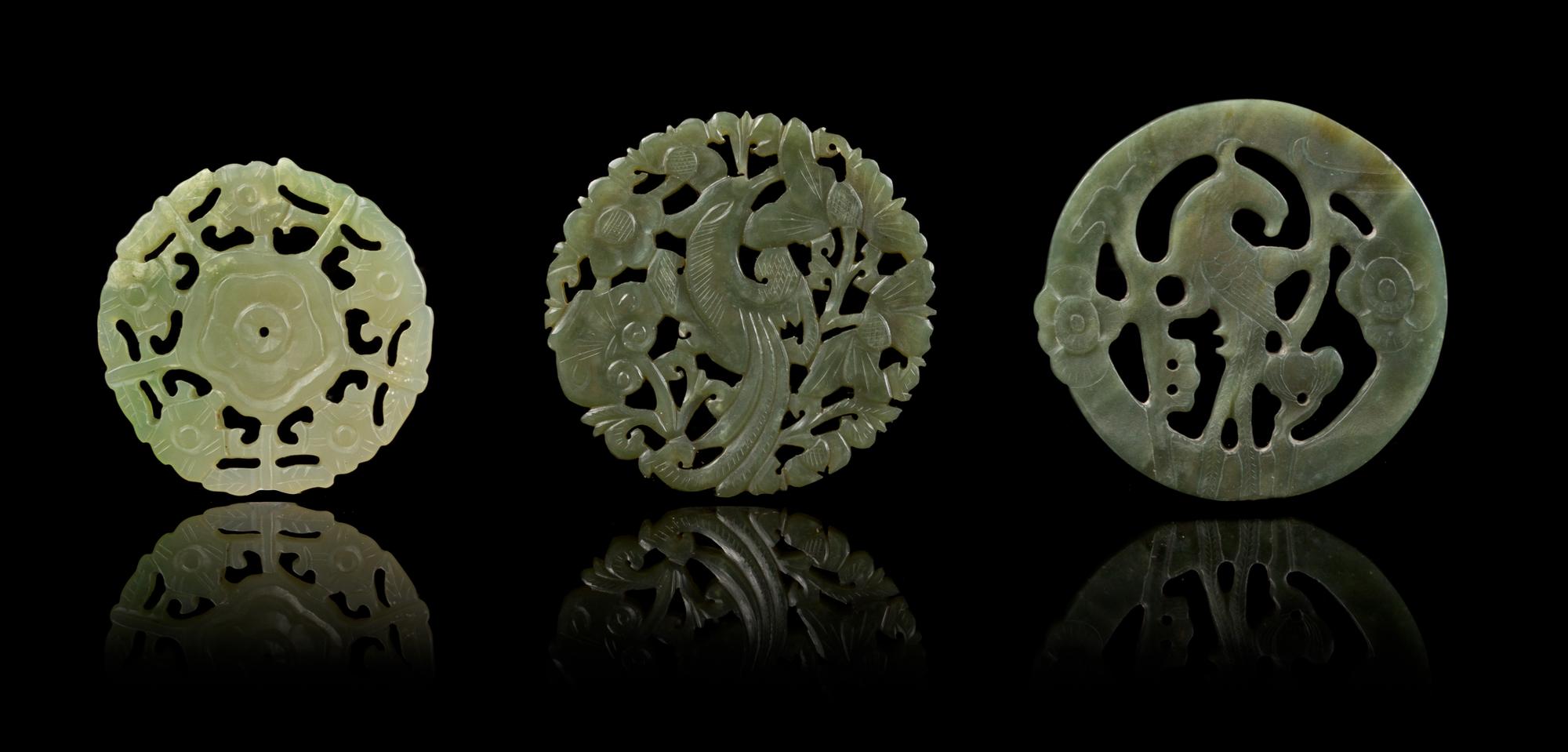 Three Pierce Carved Jade Circular Pendants Diameter of largest 2 1/2 inches.