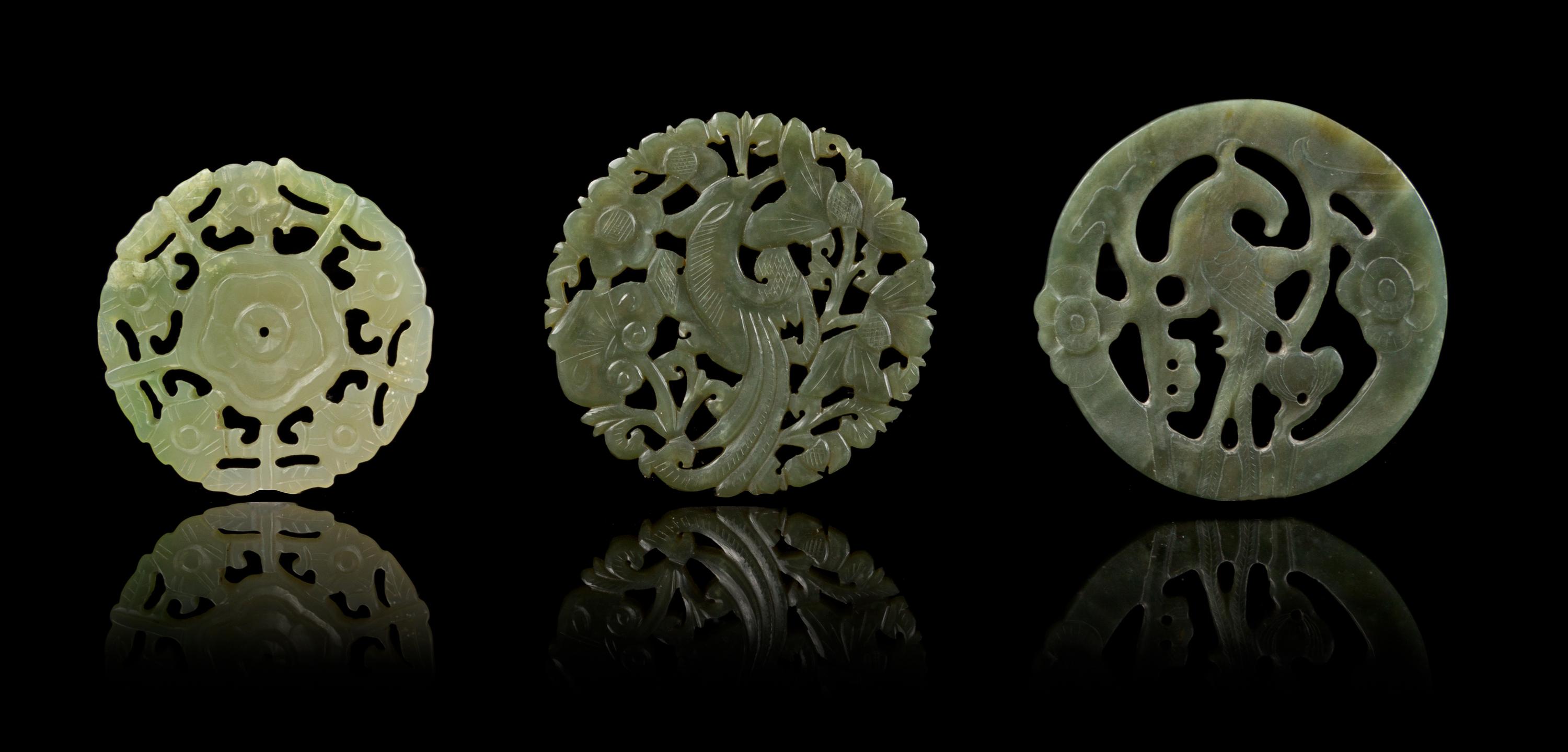 Three Pierce Carved Jade Circular Pendants Diameter of largest 2 1/2 inches.