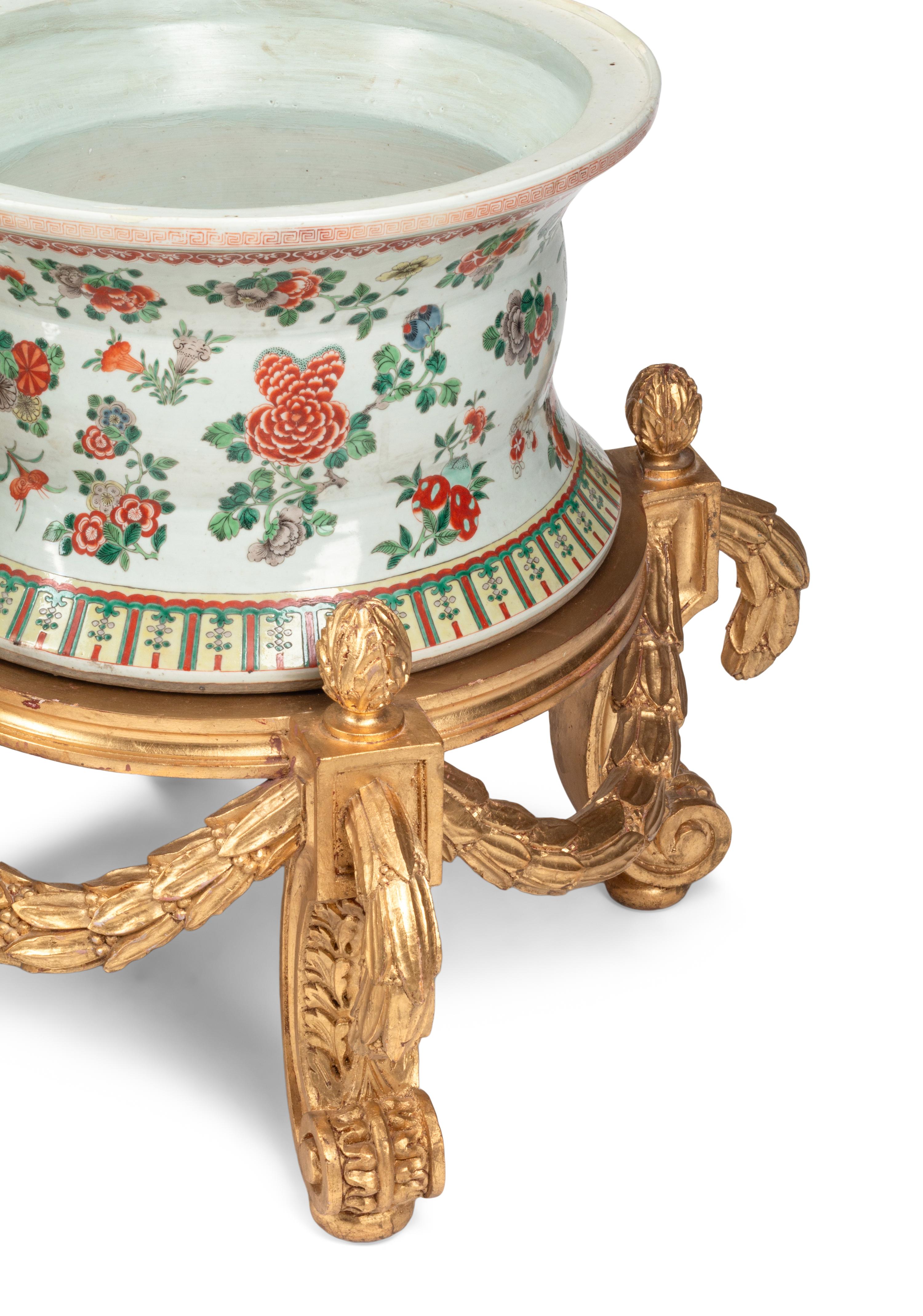 A Pair of Large Chinese Porcelain Jardinières on Giltwood Stands