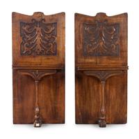 A Pair of Renaissance Revival Carved Oak Wall Shelves