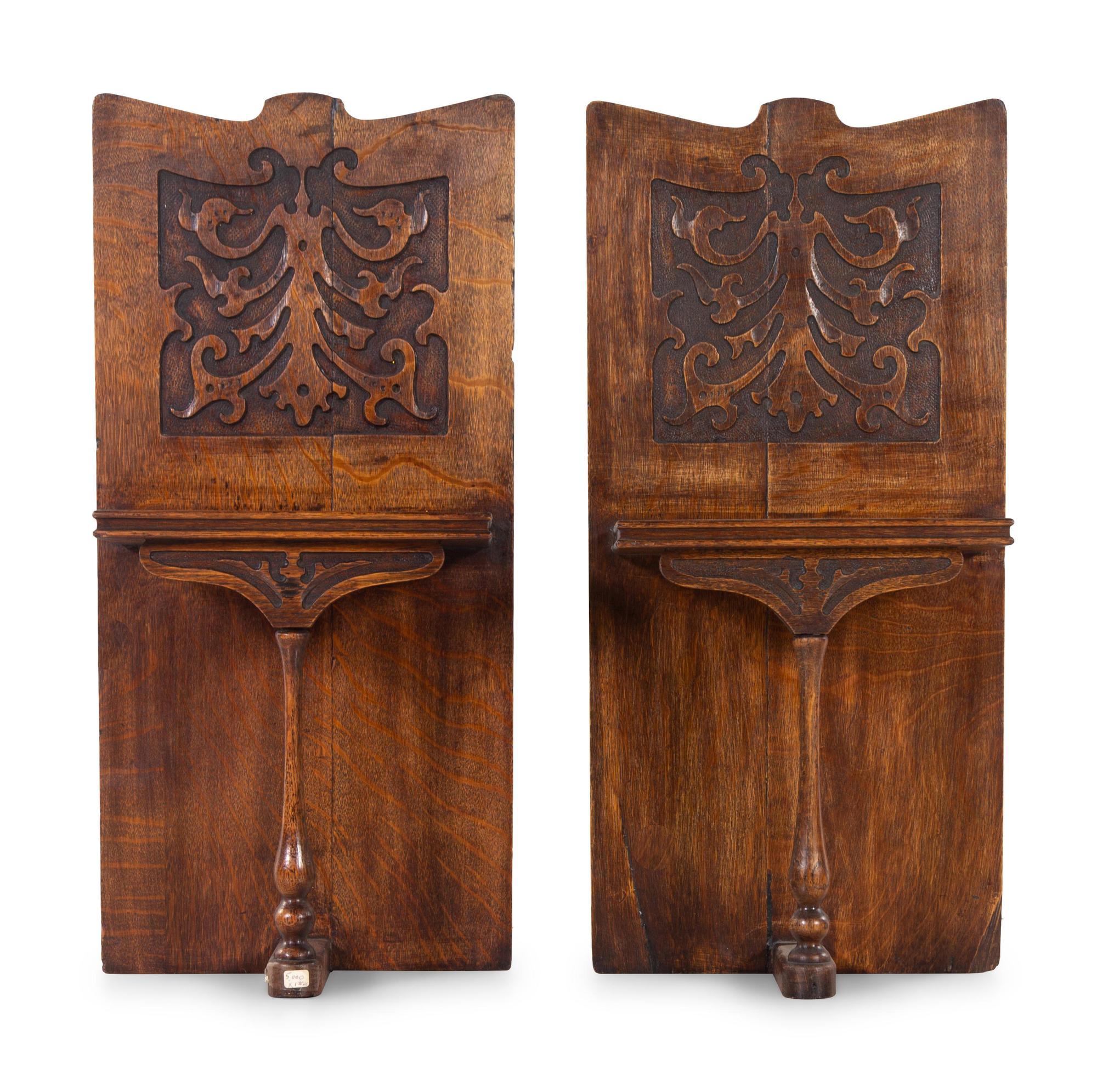 A Pair of Renaissance Revival Carved Oak Wall Shelves