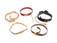A Group of Five Designer Belts by Judith Leiber, Celine, Chanel, and Gucci