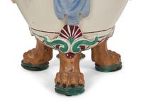 A Pair of Italian Glazed Ceramic Urns Decorated with Horned Masks and Paw Feet