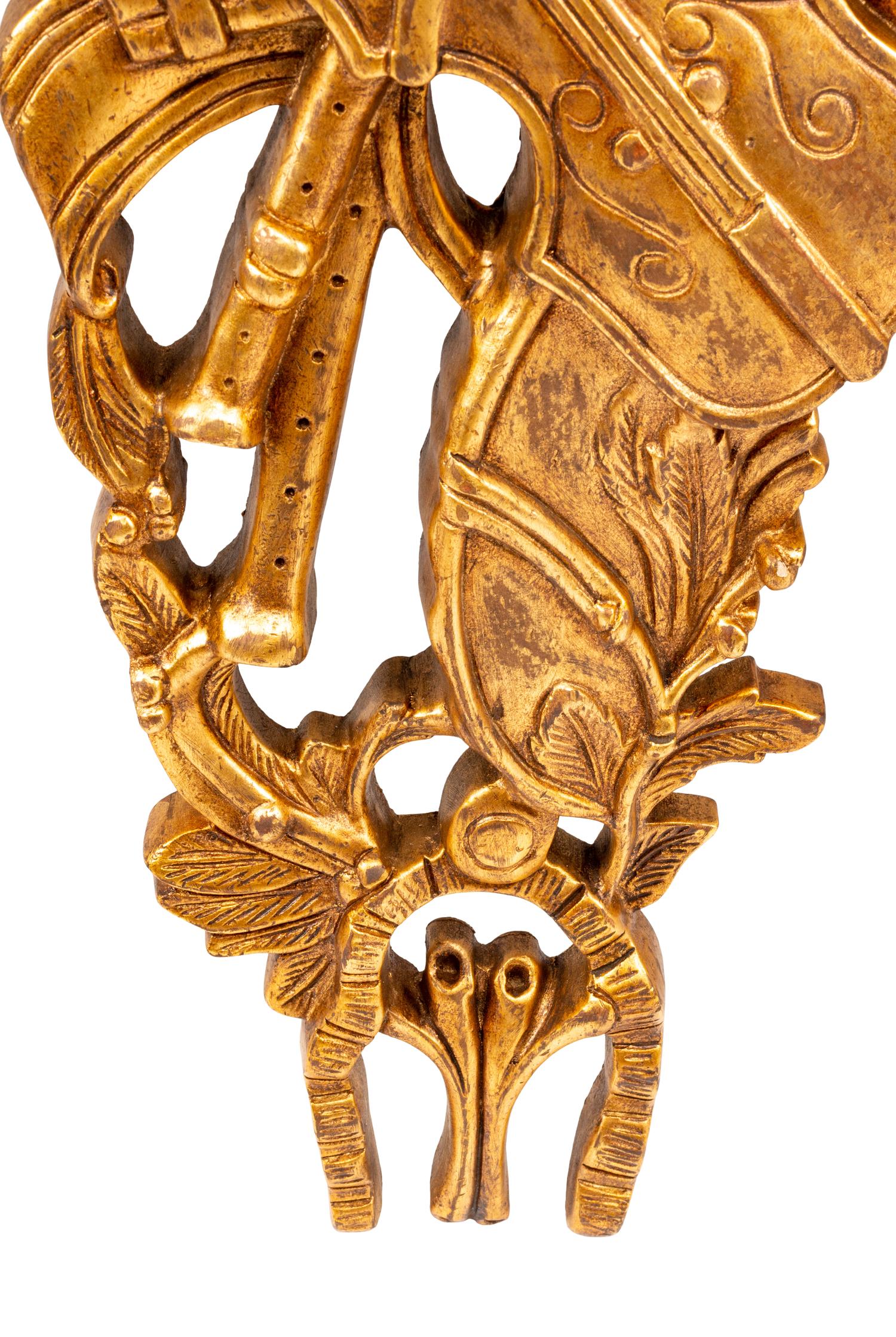 A Set of Four French Giltwood Trophy Appliqués
