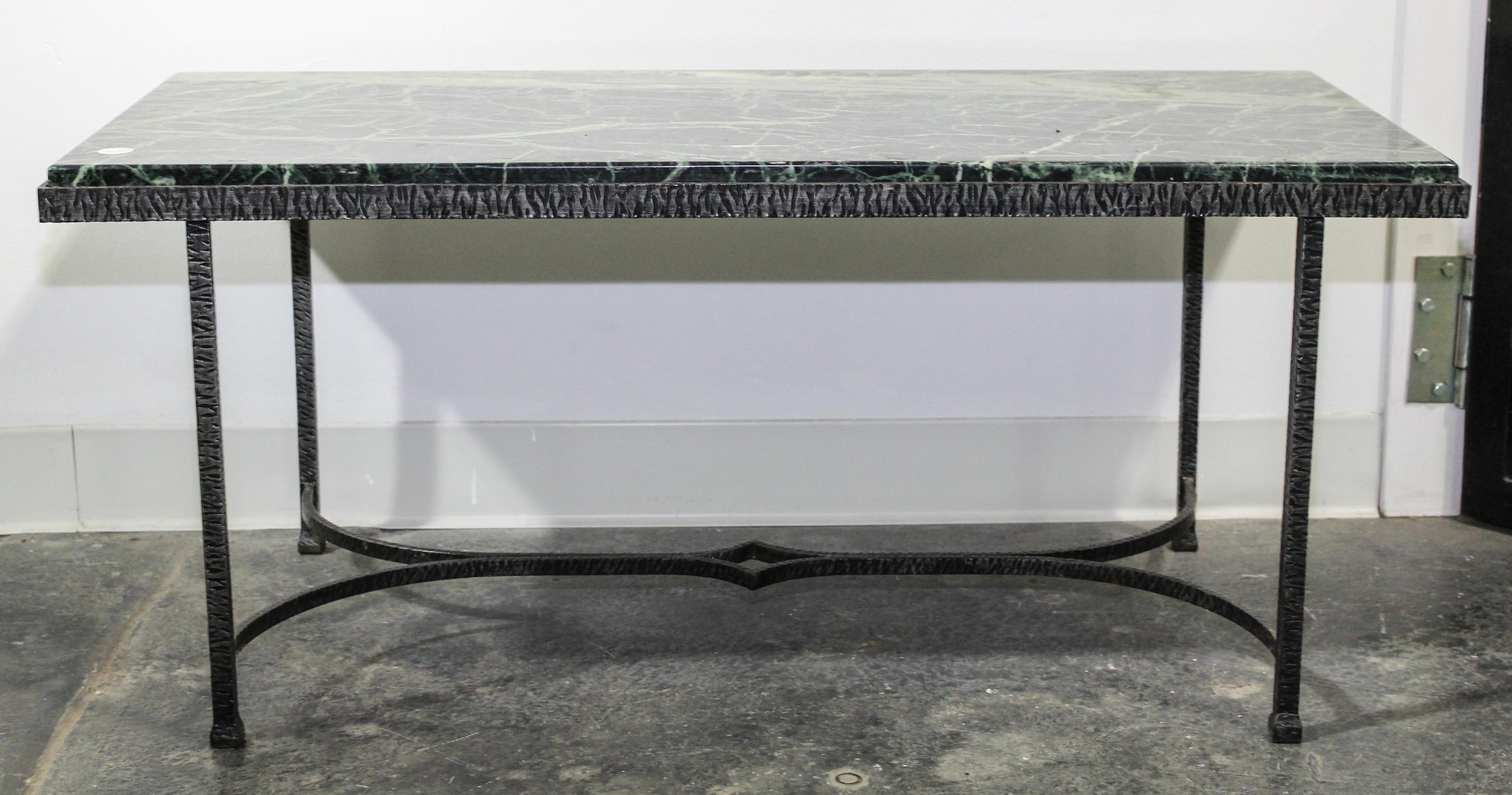 An Art Deco Style Iron and Marble Low Table. Height 17 1/2 x width 39 1/2 x depth 18 inches.