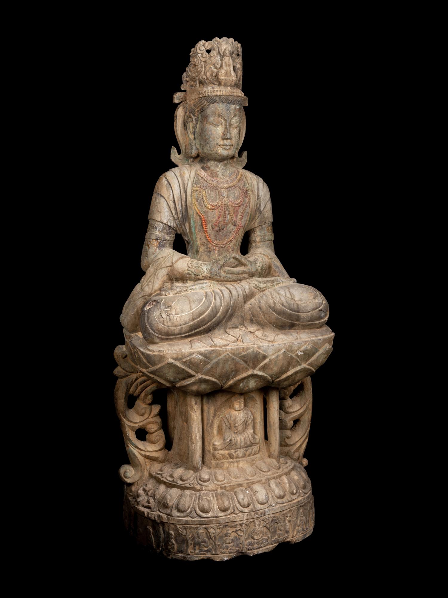 A Chinese Carved Stone Seated Guanyin Figure