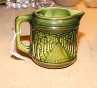 A Rockingham or Bennington Ceramic Pitcher Height 4 7/8 inches. — 19TH CENTURY