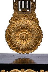 A Charles X Gilt Bronze Mounted Ebonized Portico Clock