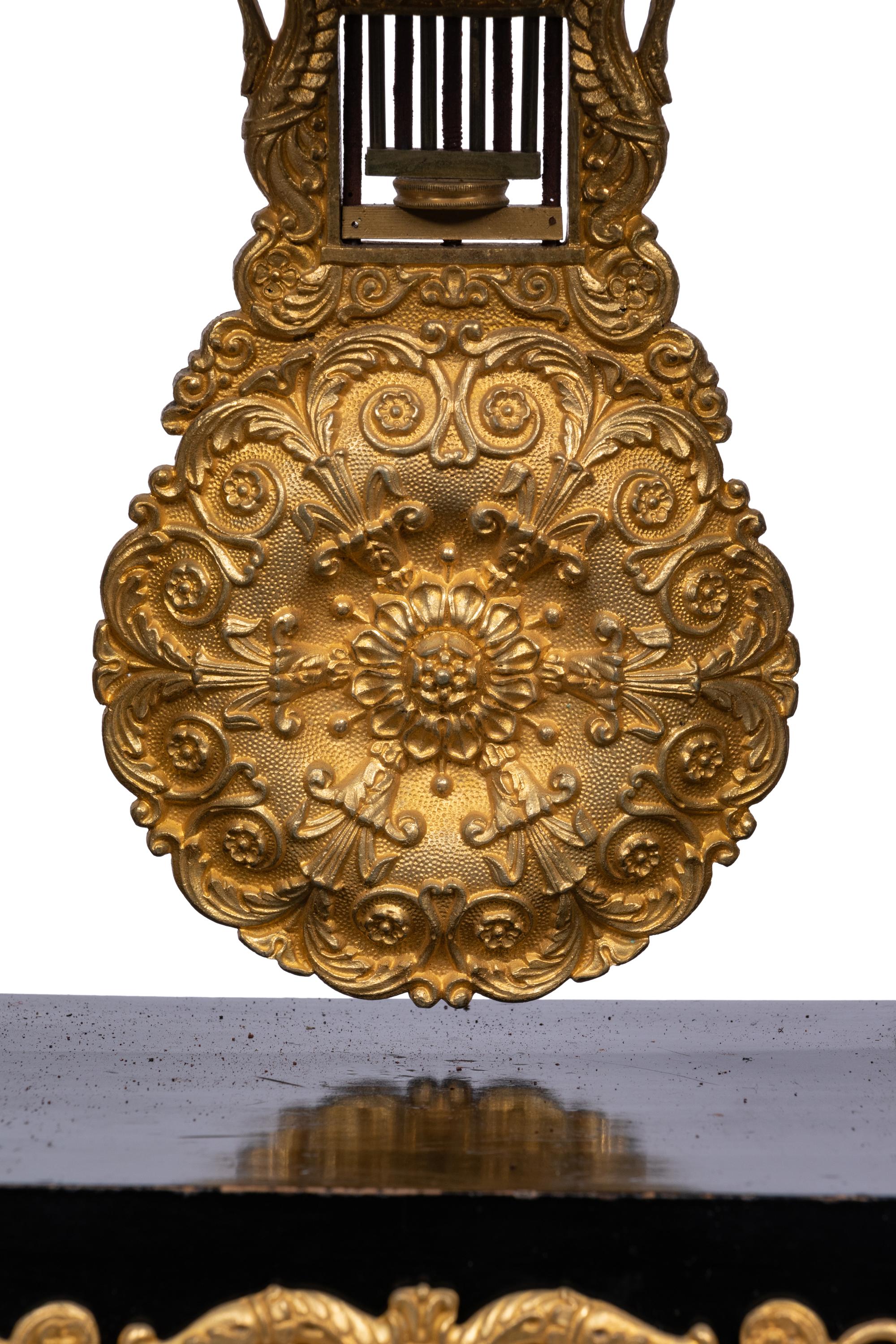 A Charles X Gilt Bronze Mounted Ebonized Portico Clock