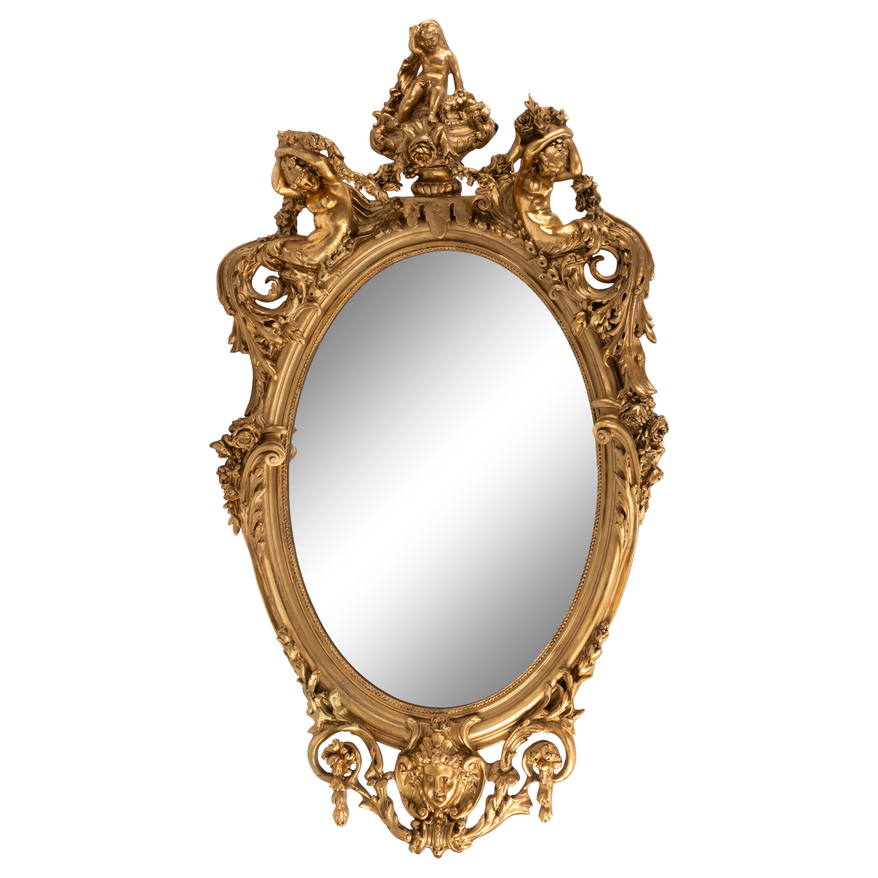 A Louis XV Style Carved Giltwood Oval Mirror