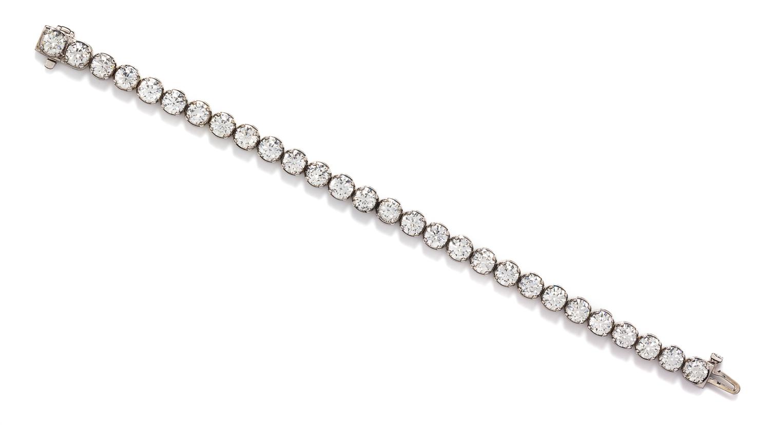 A White Gold and Diamond Line Bracelet, 14.10 dwts.