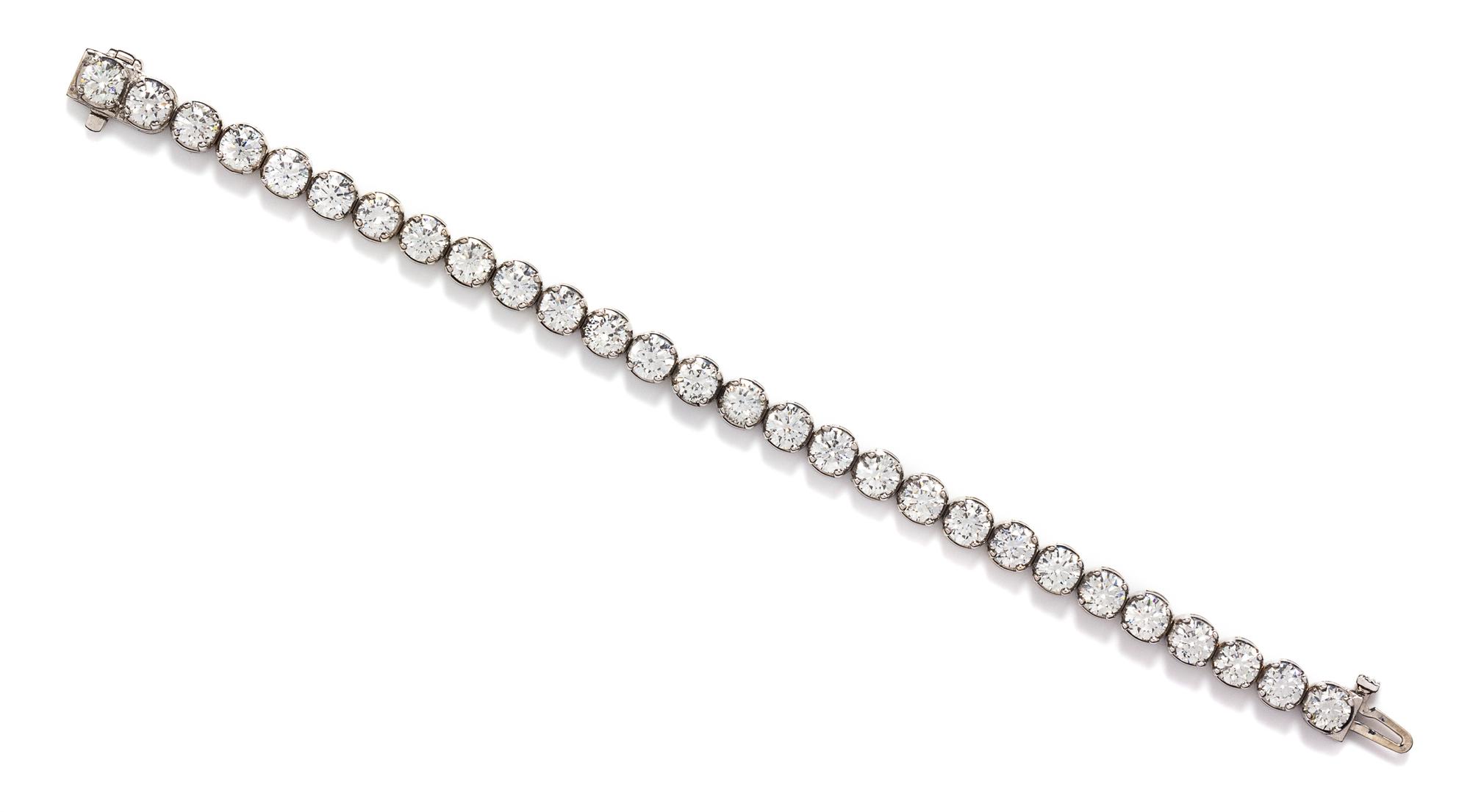 A White Gold and Diamond Line Bracelet, 14.10 dwts.