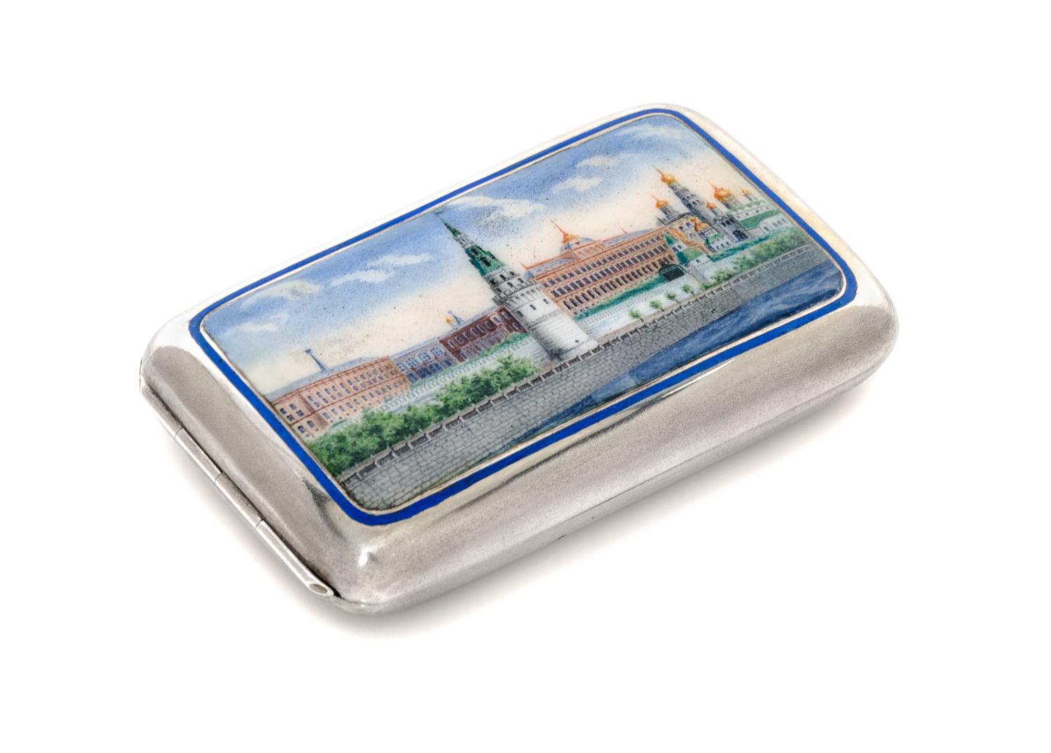 A Russian Enameled Silver Cigarette Case, Maker's mark GK, Moscow, late 19th century, the lid decorated with a painted scene of the Kre