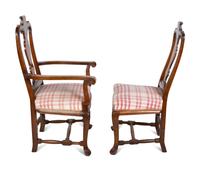 A Set of Six Continental Scroll-Carved Walnut Dining Chairs