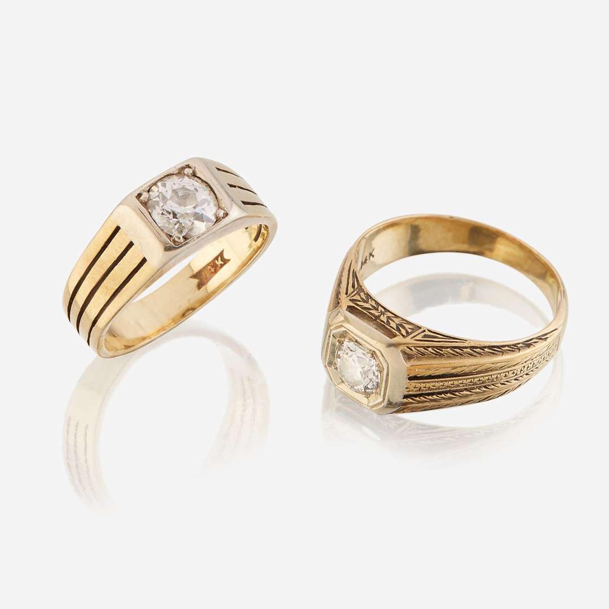 A pair of fourteen karat gold and diamond rings