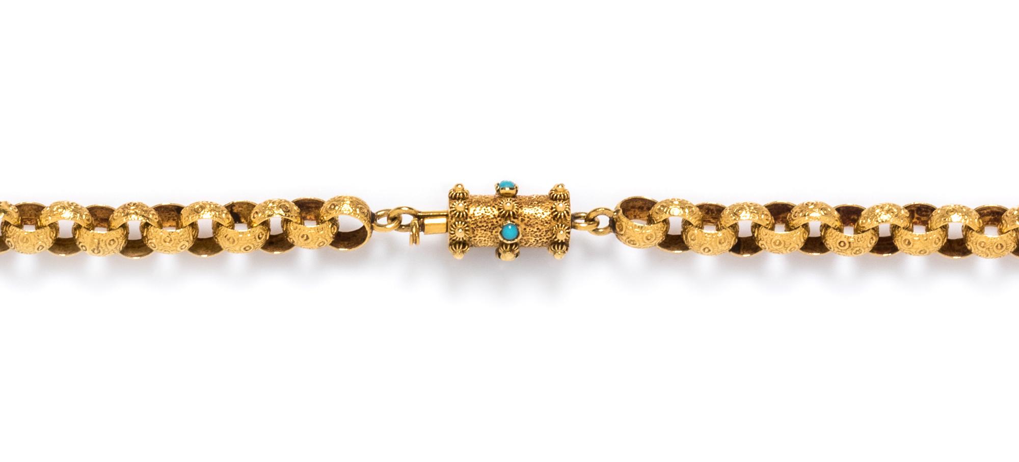 A Victorian Yellow Gold and Turquoise Muff Longchain,