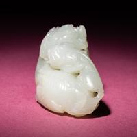 A Chinese Pale Celadon Jade Group of Fu Lions, Qing Dynasty — 清 青白玉太獅少獅把件