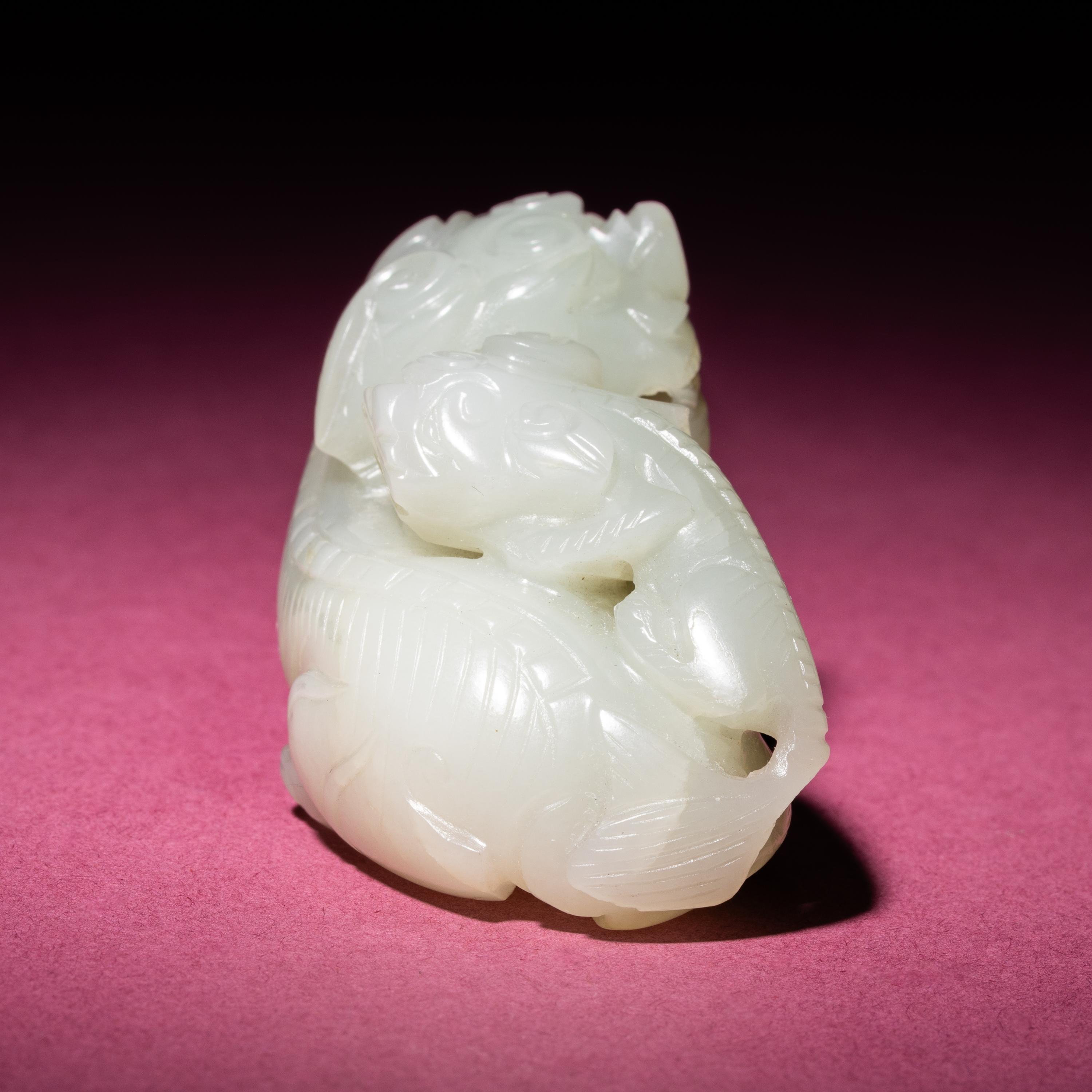 A Chinese Pale Celadon Jade Group of Fu Lions, Qing Dynasty — 清 青白玉太獅少獅把件