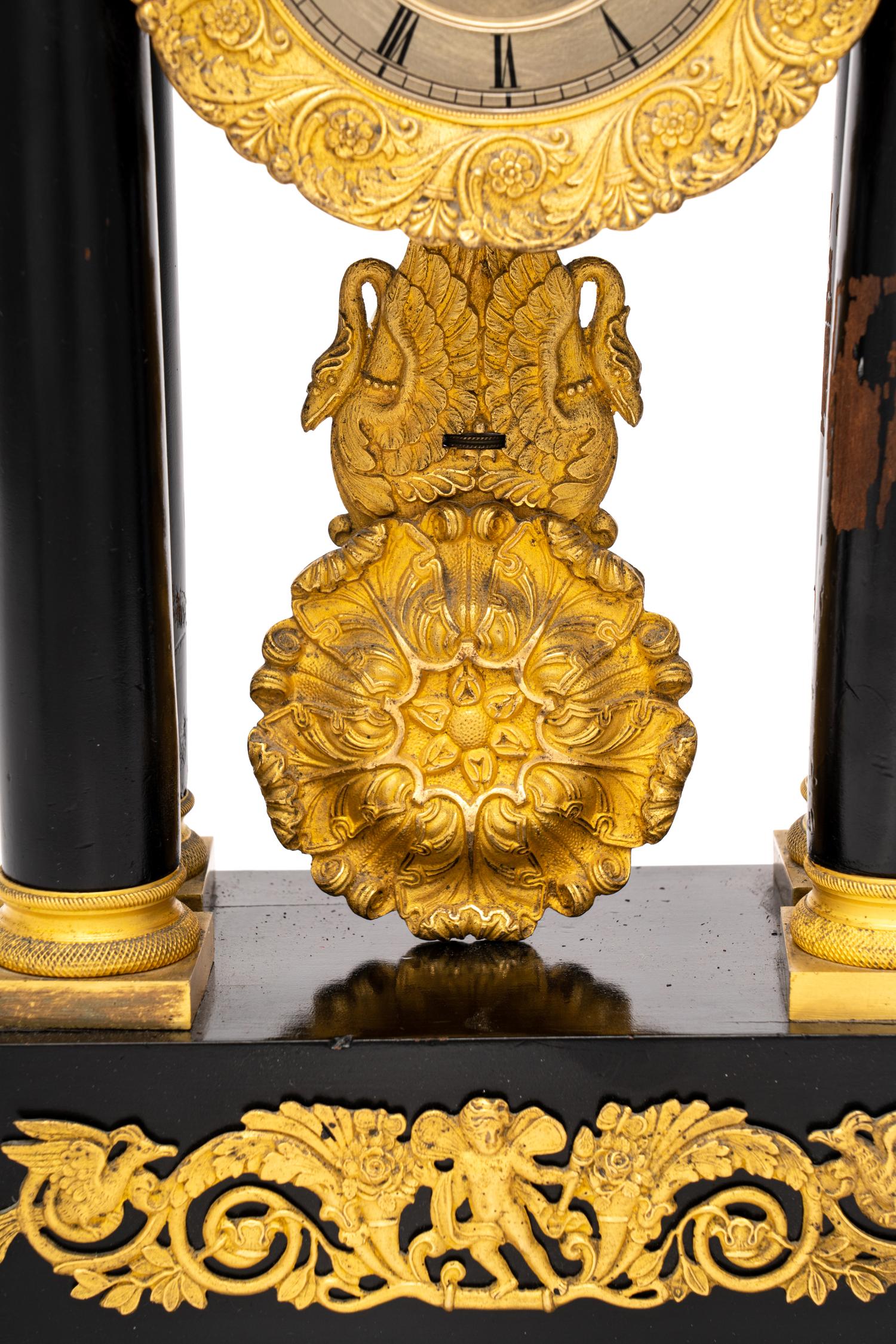 A Charles X Gilt Bronze Mounted Ebonized Fruitwood Clock