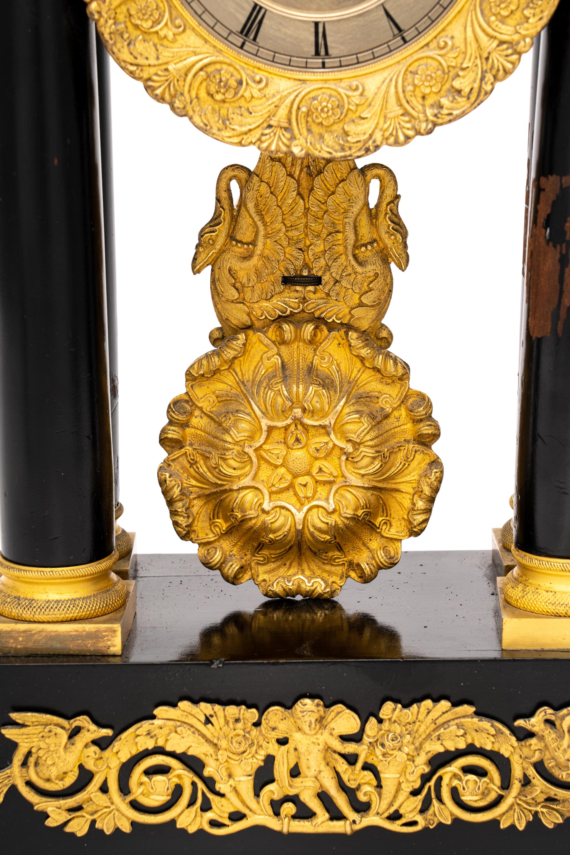 A Charles X Gilt Bronze Mounted Ebonized Fruitwood Clock