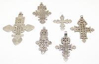 A Collection of Ethiopian Silver and Silvered Metal Cross Pendants Height of largest 4 inches.