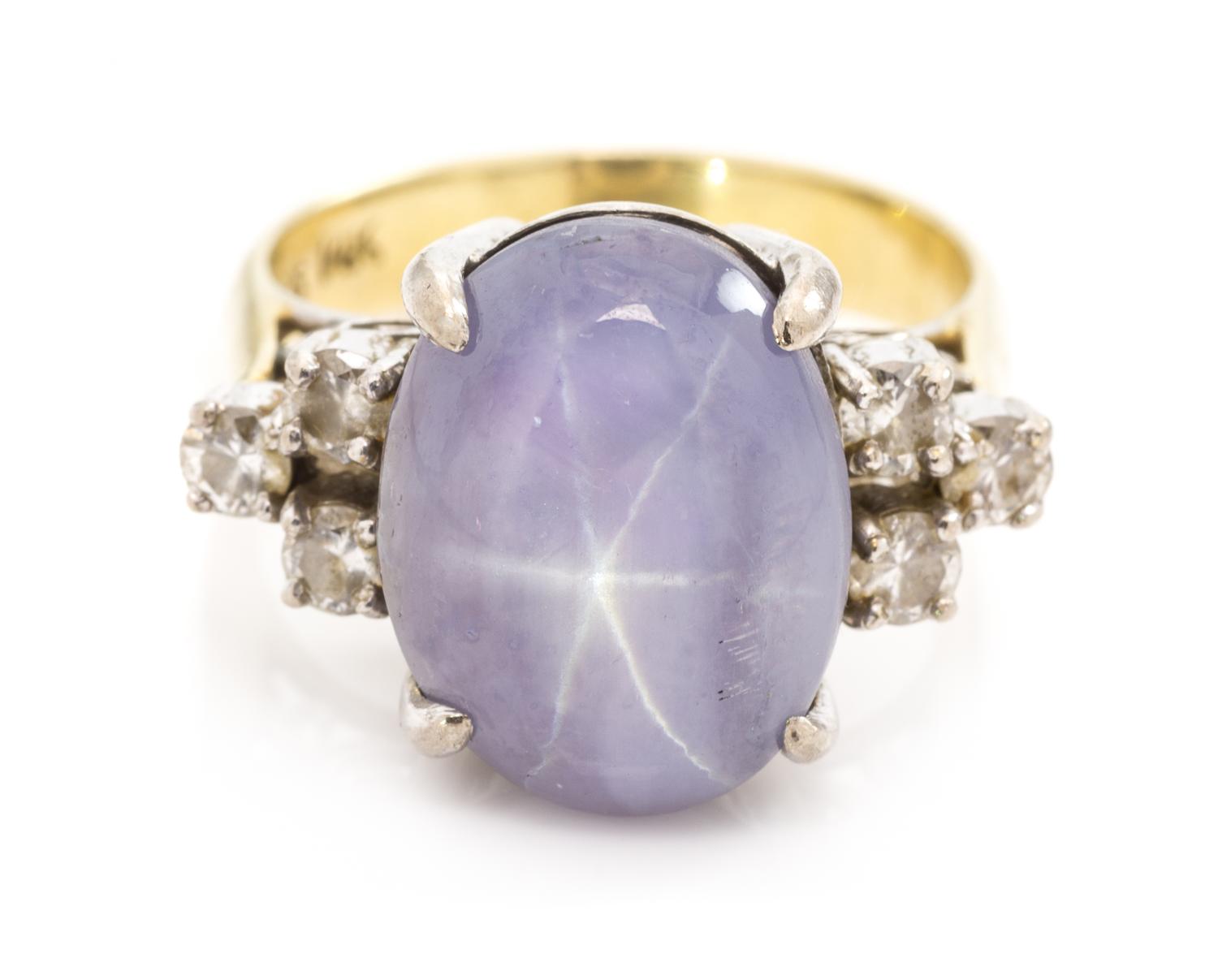 A 14 Karat Bicolor Gold, Star Sapphire and Diamond Ring, 5.20 dwts.