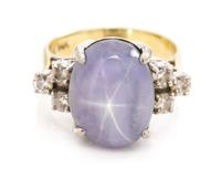 A 14 Karat Bicolor Gold, Star Sapphire and Diamond Ring, 5.20 dwts.