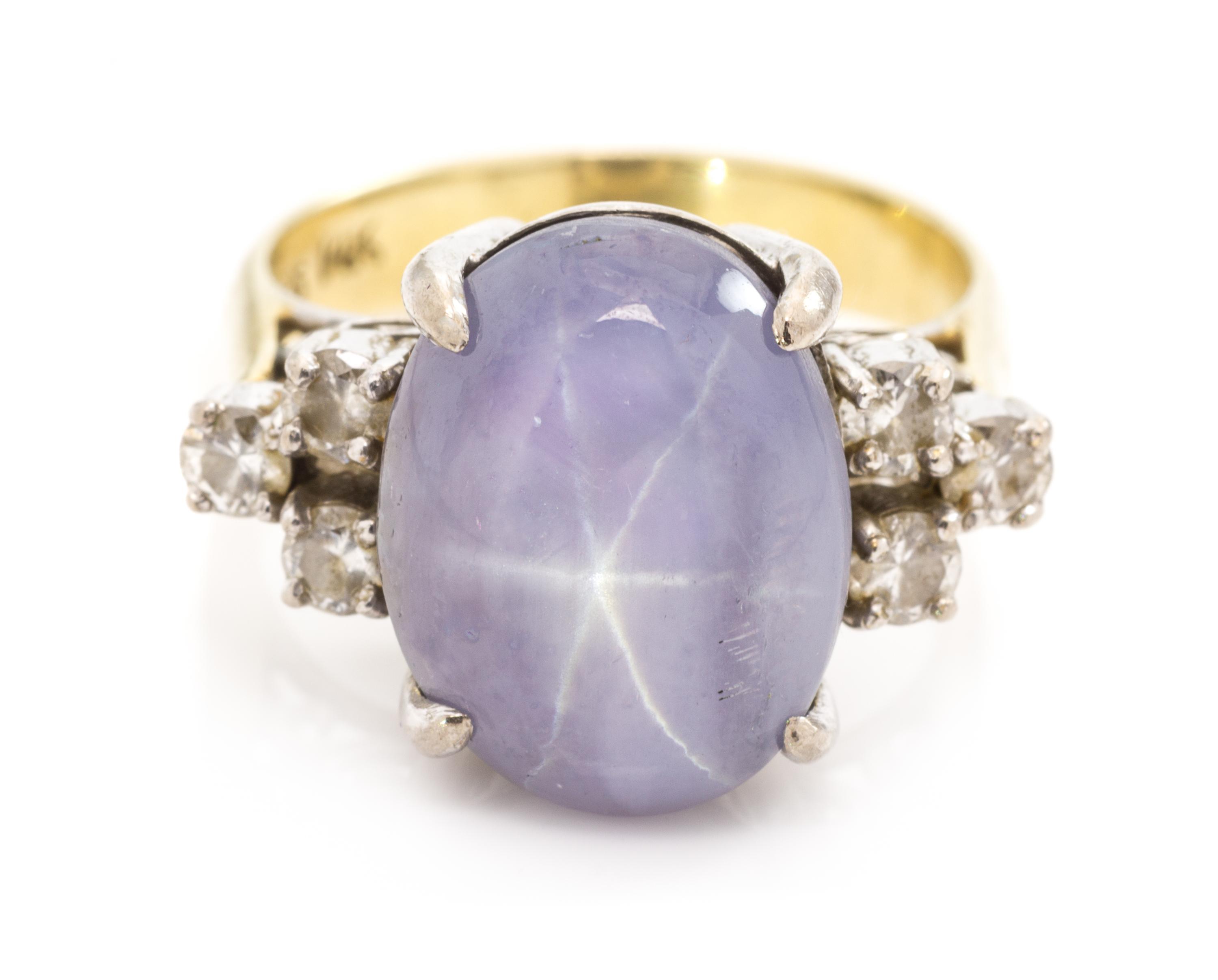 A 14 Karat Bicolor Gold, Star Sapphire and Diamond Ring, 5.20 dwts.