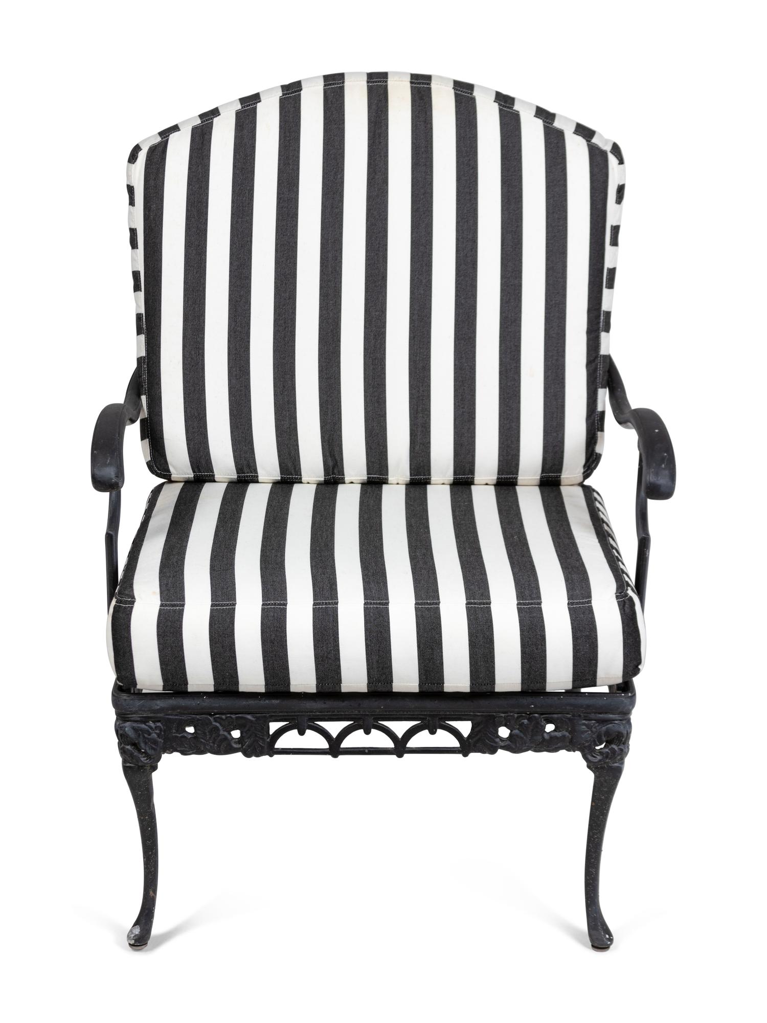 A Pair of Metal Garden Chairs and an Ottoman