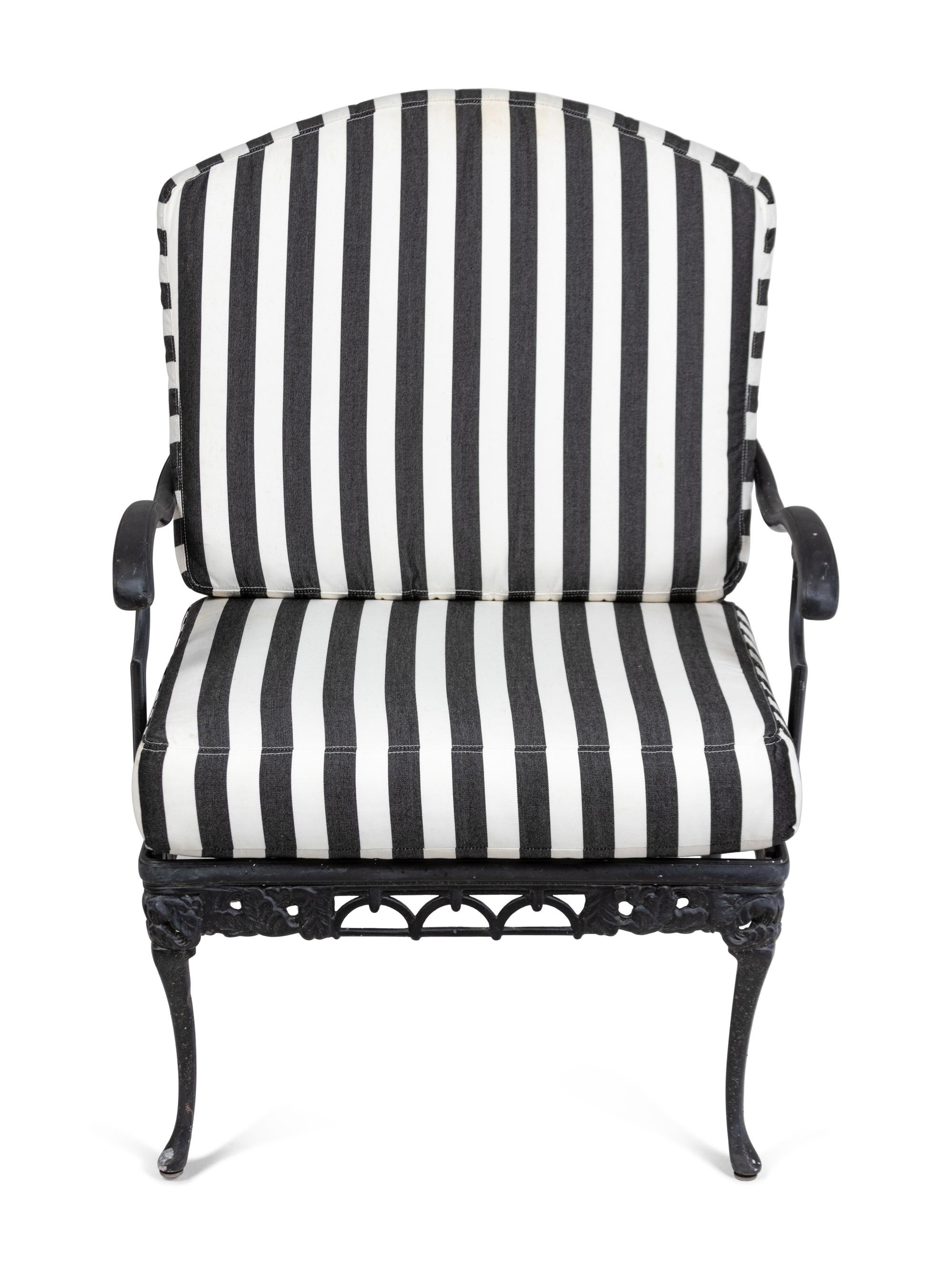 A Pair of Metal Garden Chairs and an Ottoman