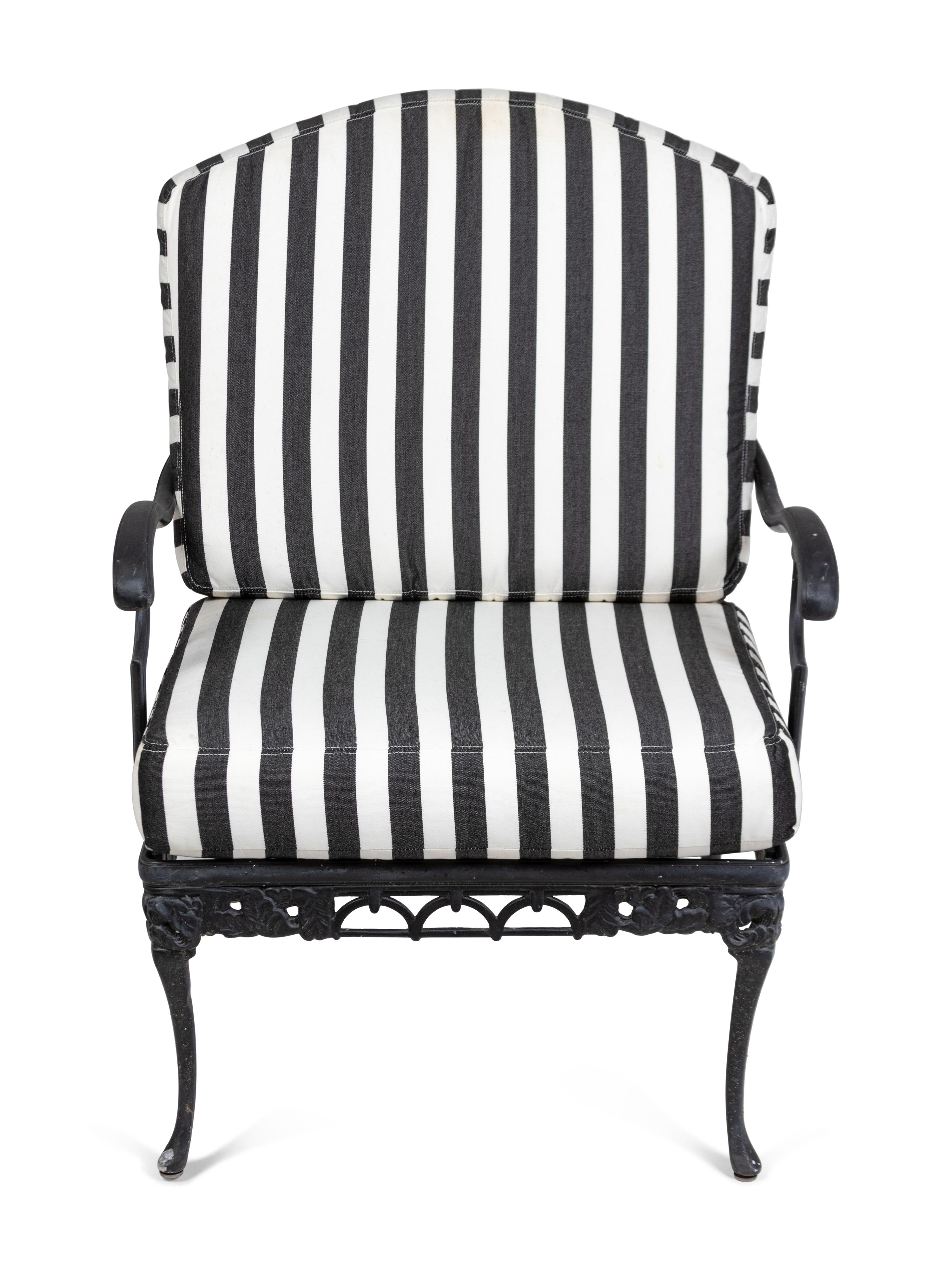 A Pair of Metal Garden Chairs and an Ottoman