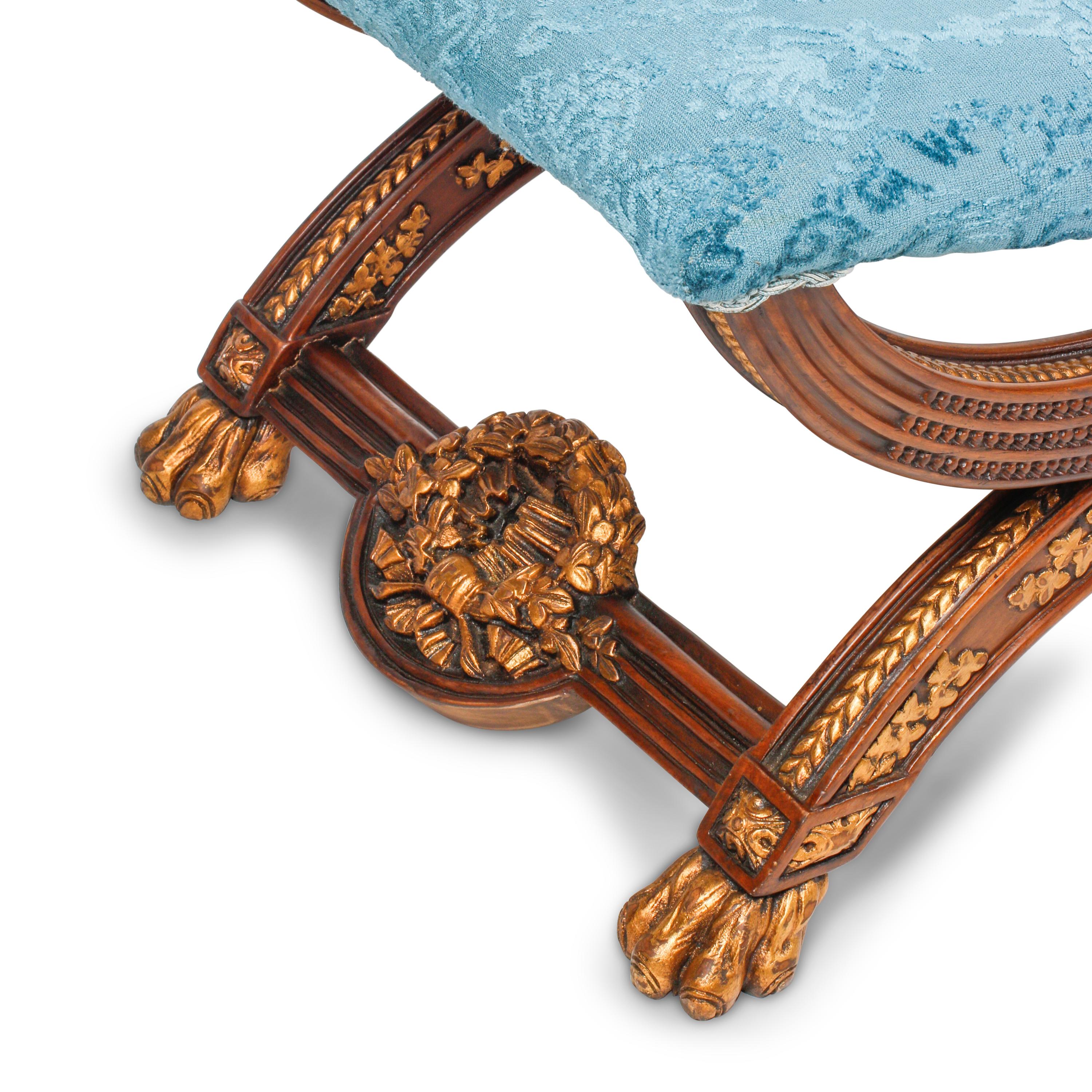 A Set of Four Italian Neoclassical Style Carved and Parcel Gilt Walnut Benches
