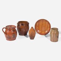 A group of five slip-decorated and incised redware tablewares 19th century