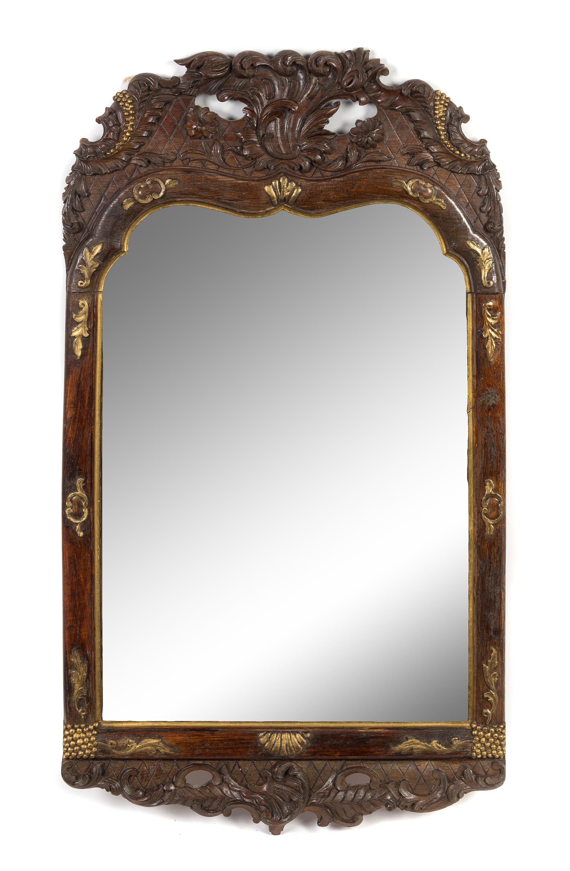 A Rococo Style Parcel Gilt Carved Mirror Height 32 1/4 x width 18 1/2 inches. — 19TH CENTURY