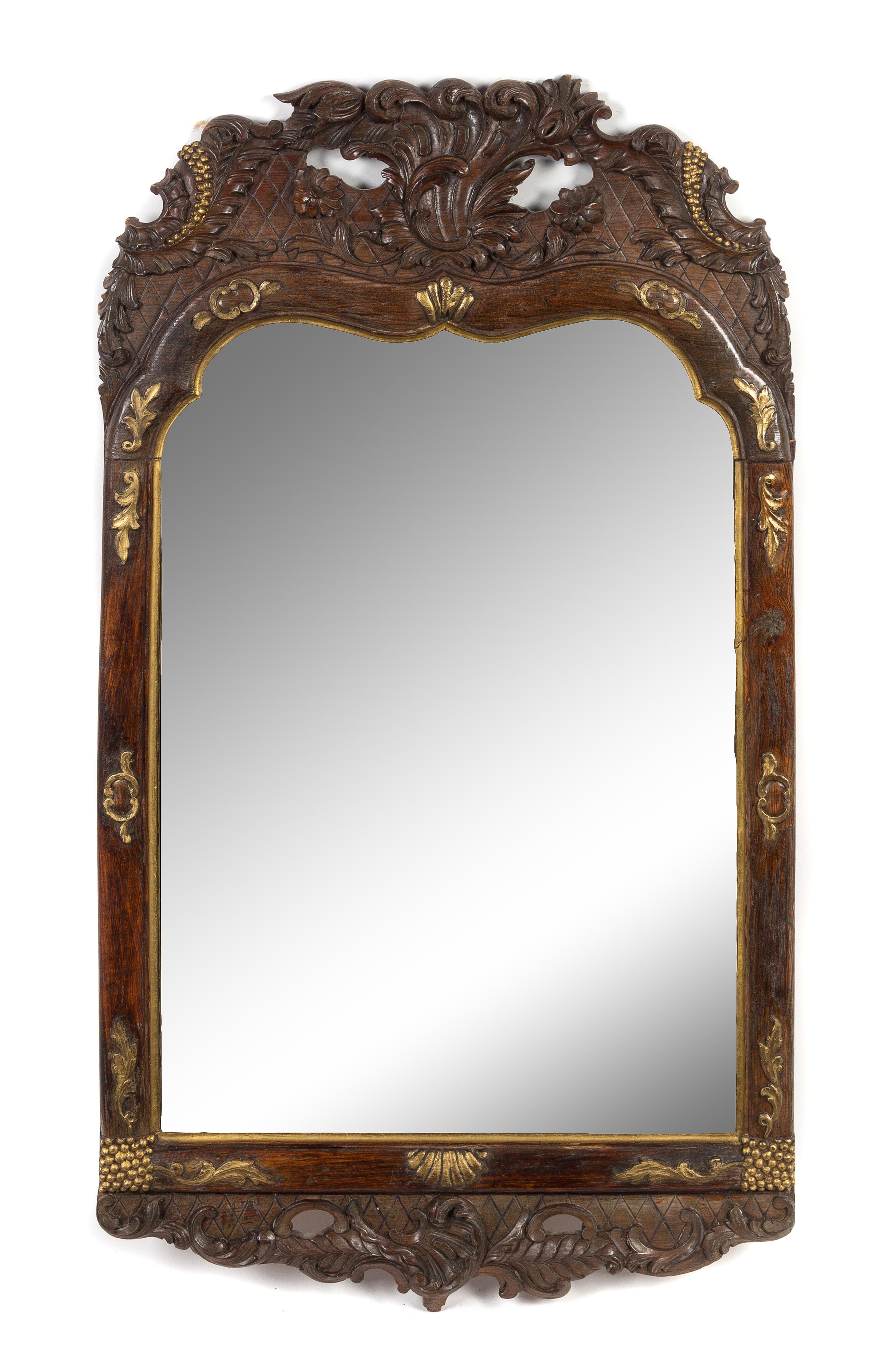 A Rococo Style Parcel Gilt Carved Mirror Height 32 1/4 x width 18 1/2 inches. — 19TH CENTURY