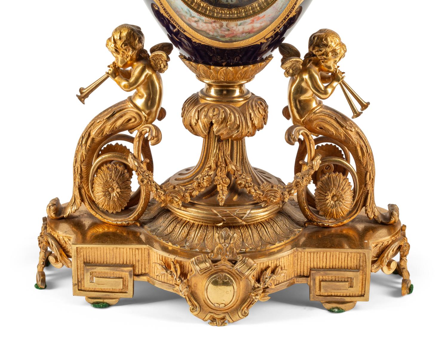 A French Gilt Bronze and Sèvres Style Porcelain Clock Garniture