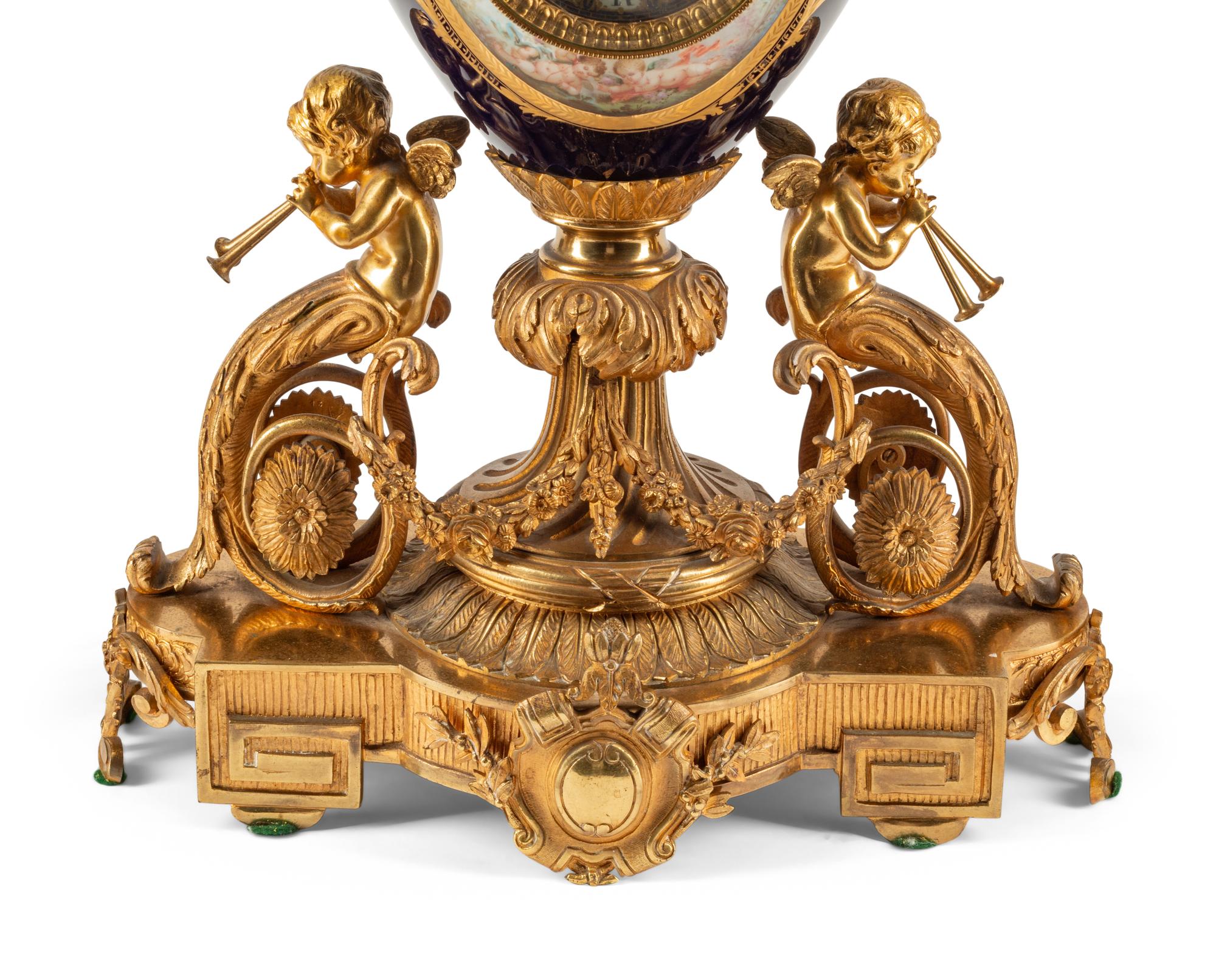 A French Gilt Bronze and Sèvres Style Porcelain Clock Garniture