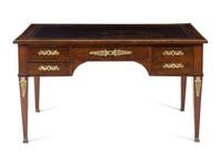 An Empire Style Gilt Metal Mounted Mahogany Bureau Plat and an Associated Armchair