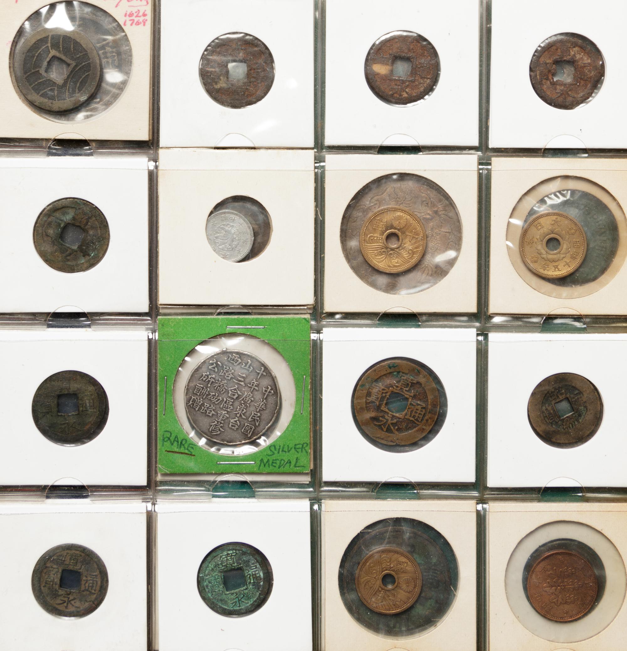 A Large Collection of Chinese Coins and Pendants