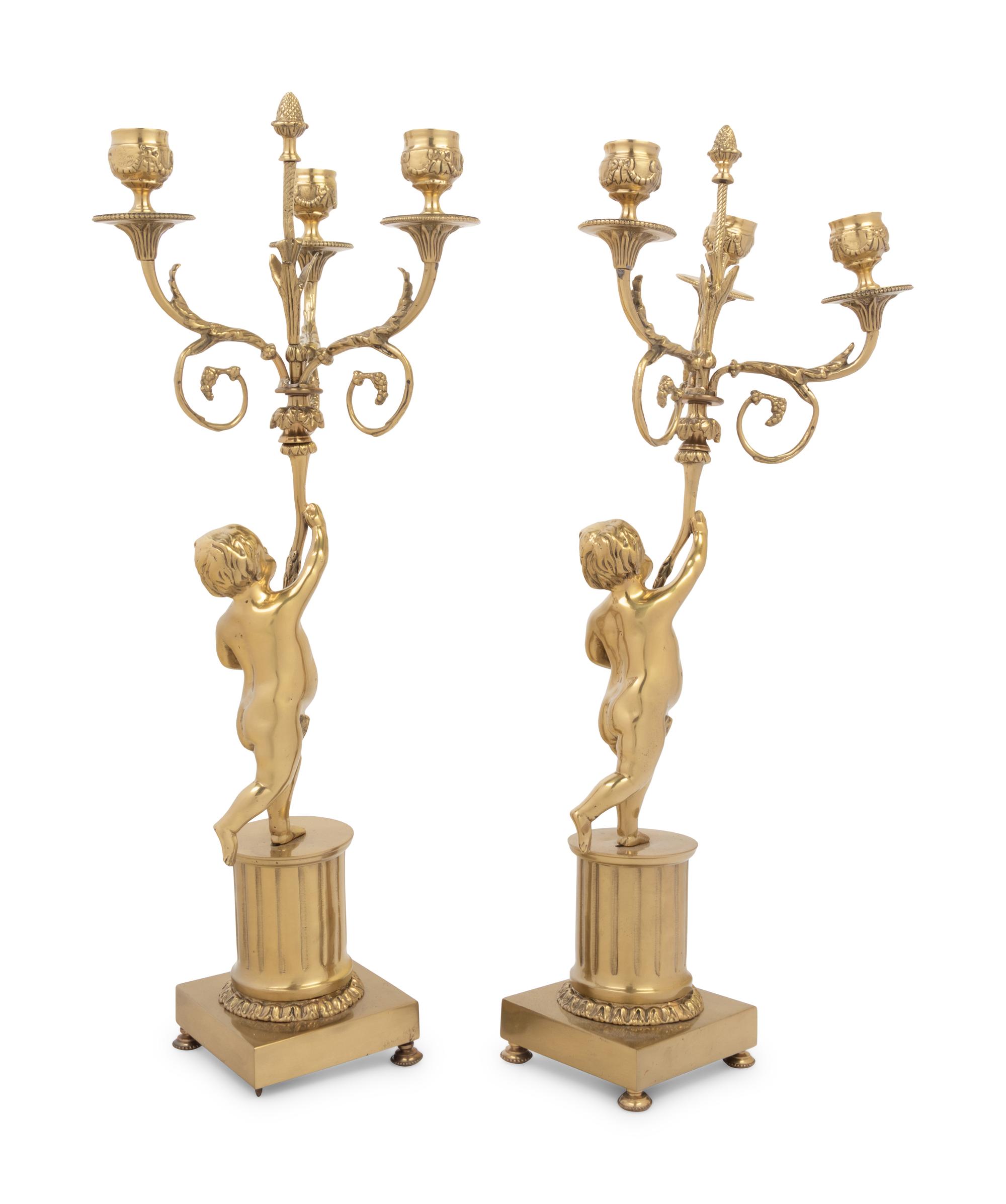 A Pair of Louis XV Style Gilt Metal Three-Light Candelabra