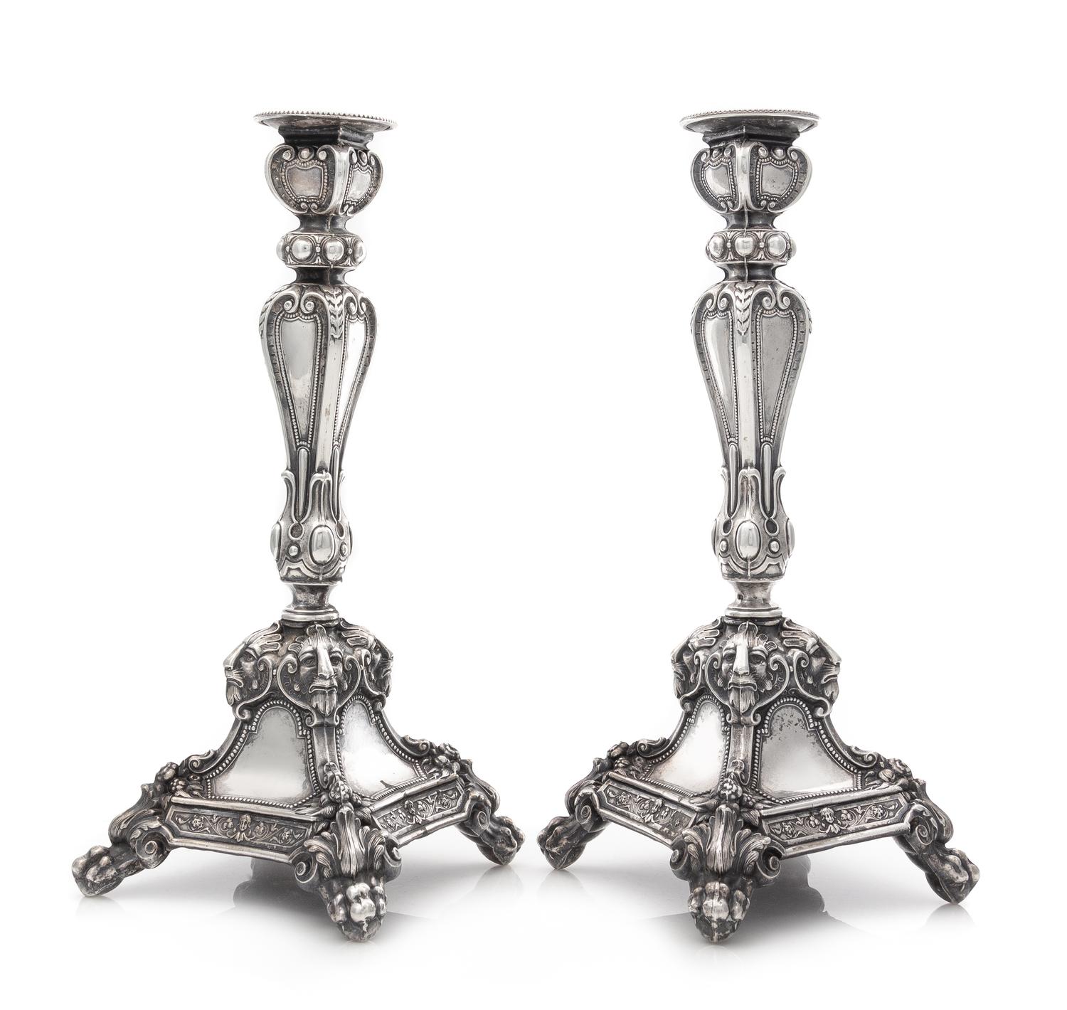 A Pair of Austrian Silver Candlesticks, Maker's Mark HS, Vienna, 19th Century, each stem of paneled baluster form with foliate and geom