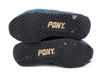 A Pair of Greg Maddux Game Used Pony Cleats,